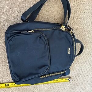 Tumi small backpack style purse Blue and Gold